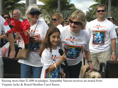 Raising more than $1,000 in pledges, Samantha Narson receives an award from Virgina Jacko & Board Member Carol Russo
