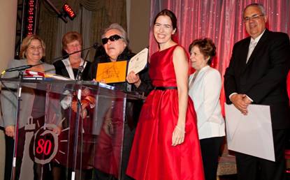 Jose Feliciano receives honorary Miami Senior High School diploma presented by Superintendent Alberto Carvalho's Chief of Staff Daniel Tosado and School Board Member Raquel Regalado