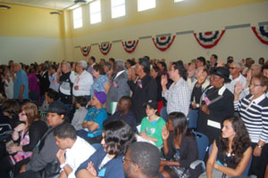 Miami Lighthouse performers watch as citizens are sworn in
