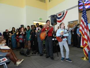 Miami Lighthouse performers congratulate the new citizens