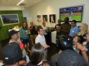 Miami Marlins President David Samson asks the summer camp students about their favorite experience during the touch tour.