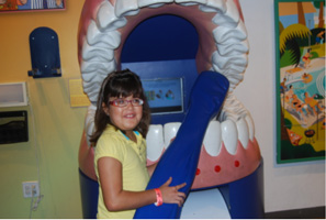 Miami Lighthouse child learns about the job of a dentist. 
