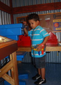 Child explores the wonders of being a construction worker.