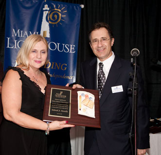 Deborah A. Montilla, Dis. Dir. Division of Student Services, M-D County Schools receives award from Dr. Alan Levitt, Heiken Committee Member