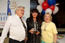 Division of Blind Services District Administrator Gail Sterner accepting her award presented by Paul Edwards, President of the Florida Council of the Blind and CEO Virginia Jacko