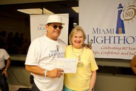 CEO Virginia Jacko with Hugo Meneses, Pledge Winner runner-up