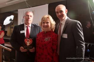 Honorary Board Director Honoree Ray Casas, CEO Virginia Jacko, and Chairman of the Board Agustin Arellano Jr.