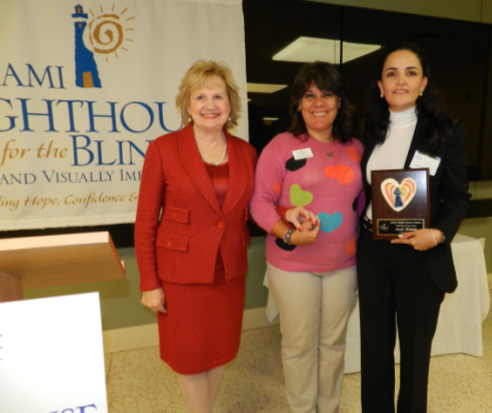 President & CEO Virginia Jacko, Coordinator of Arts & Crafts Nelbra Gonzalez and Honoree Susie Wahab.