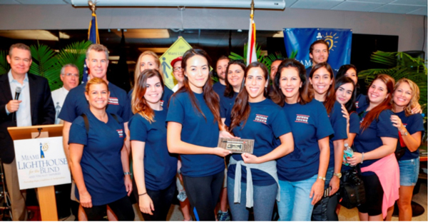 Far left emcee John Morales and Board Chair Ramon Casas, front row left Board Director Donna Abood with Avison Young participantsFar left emcee John Morales and Board Chair Ramon Casas, front row left Board Director Donna Abood with Avison Young participants.