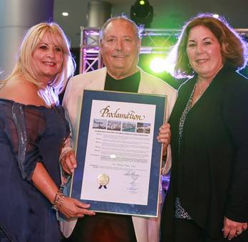 Representing Commissioner Sally Heyman, Mary Juncadella-Ferreiro and Bonnie Michaels present Dr. Sidney Stern proclamation