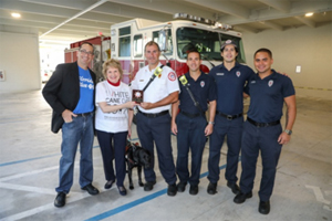 Doug Bartel of Florida Blue and CEO Virginia Jacko with City of Miami Department of Fire Rescue