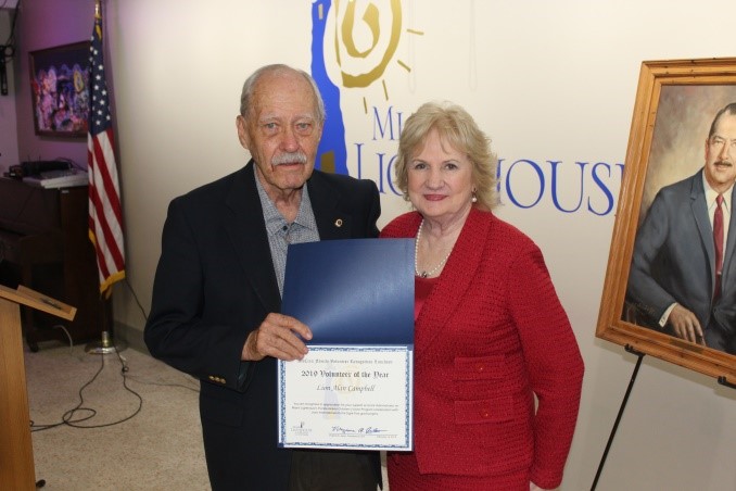 Honoree Lion Alan Campbell with CEO Virginia Jacko.