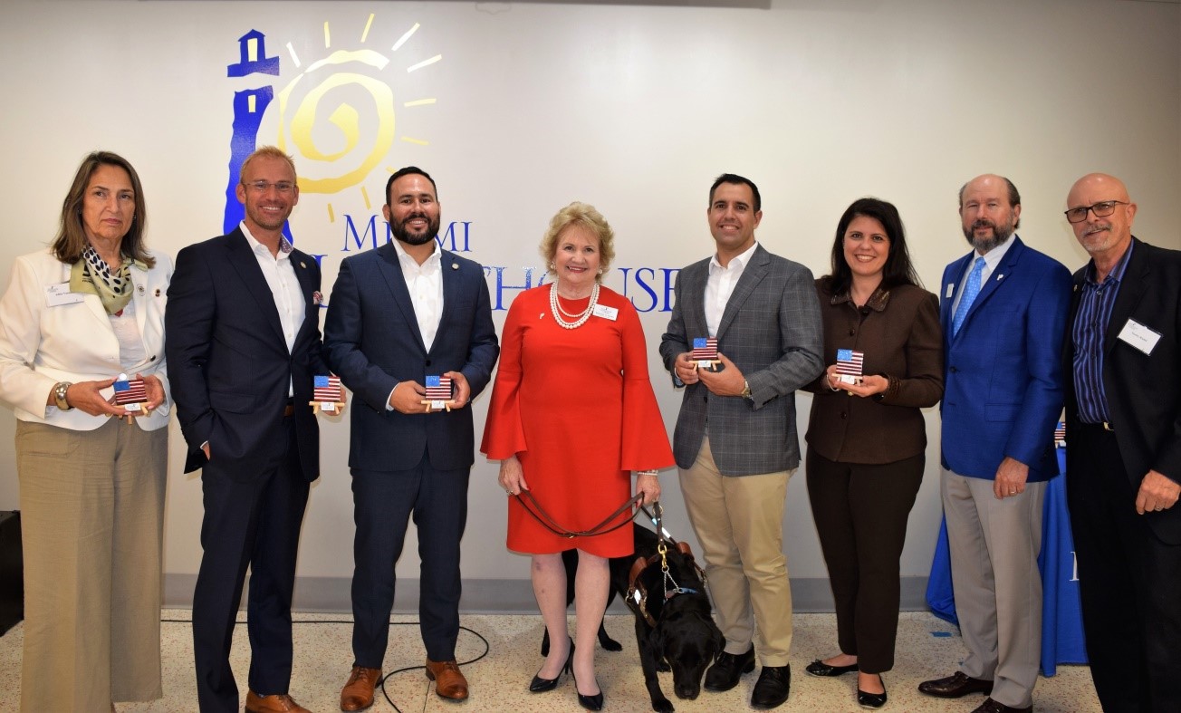 Adita Vazquez, Lions District Governor 35-N, Representative Michael Grieco, Representative Nicholas Duran, CEO Virginia Jacko, Representative Juan Fernandez-Barquin, Representative Ana Maria Rodriguez, Board Chair George Foyo and Norby Rudel, President of Miami Rotary Club.