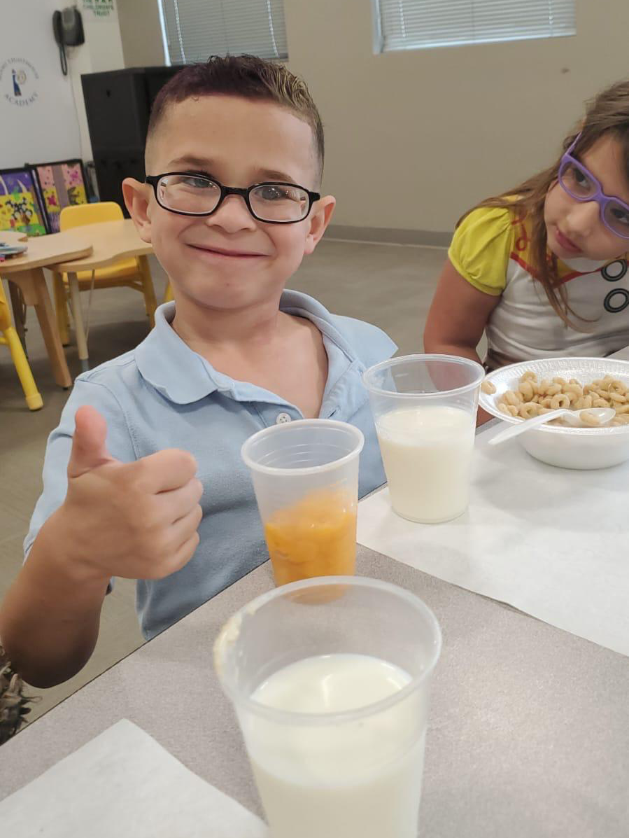 Kayler enjoying his school breakfast