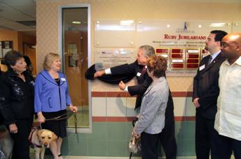 Board Director Ray Casas unveils the plaque with (from left to right) Board Director Gloria Martin, CEO Virginia Jacko, Senator Nan Rich, Representative Jose Felix Diaz and Senator Oscar Braynon.